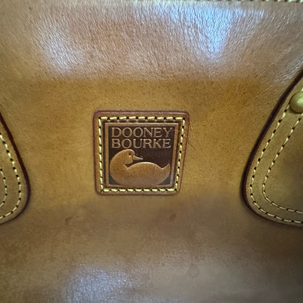 Dooney Burke leather, 16 wide 10 1/2 tall.  Red interior.